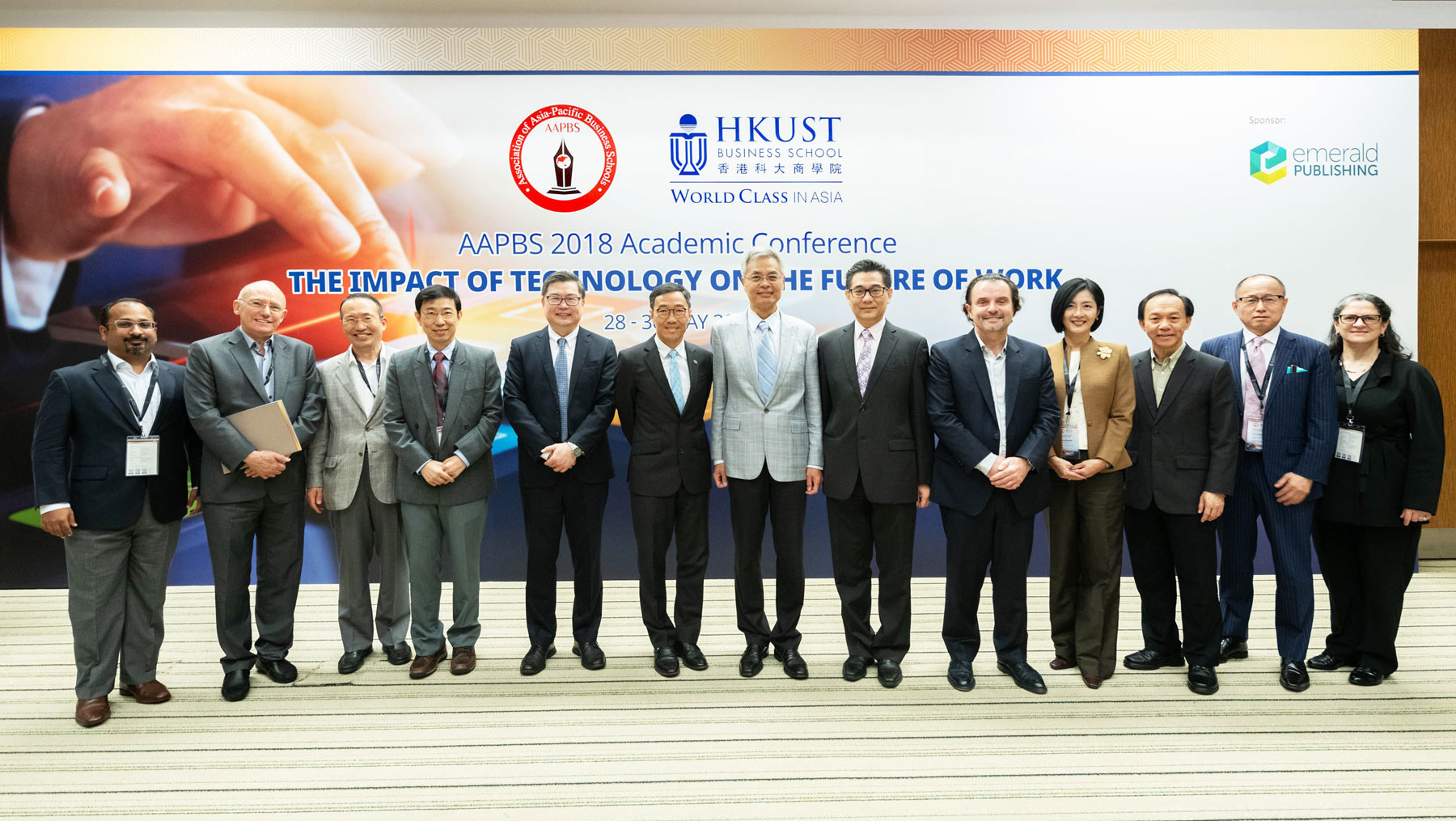 Ir. Allen Yeung, Government Chief Information Officer (6th right), in group photo with Prof Shyy Wei, Acting President, HKUST (7th right), Mr Albert Wong, CEO, Hong Kong Science and Technology Parks Corporation, (6th left), Prof Tam Kar Yan, President of AAPBS and Dean of HKUST Business School (5th left), Prof Eric Cornuel, Director General & CEO, EFMD (5th right), Prof Chen Chialin, Associate Dean of International Affairs & Global MAB, College of Management, National Taiwan University  (4th left), Dr Kang Jikyeong, President and Dean, Asian Institute of Management (4th right), Prof Lee Heeseok, Vice Dean, College of Business, Korea Advanced Institute of Science and Technology (3rd left), Prof Hum Sin Hoon, Deputy Dean, National University of Singapore Business School (3rd right), Prof Ian Fenwick, Interim Deputy Director, Sasin School of Management (Bangkok) (2nd left), Prof Yokoyama Kenji, Vice-President/President Elect of AAPBS, and Vice-President & Executive Dean, Ritsumeikan Asia Pacific University (2nd right),  Prof Anirban Mukhopadhyay, Associate Dean, HKUST Business School (leftmost) and  Prof Véronique J. A. Lafon-Vinais, Executive Director (Career Development & Corporate Outreach), HKUST Business School (rightmost).