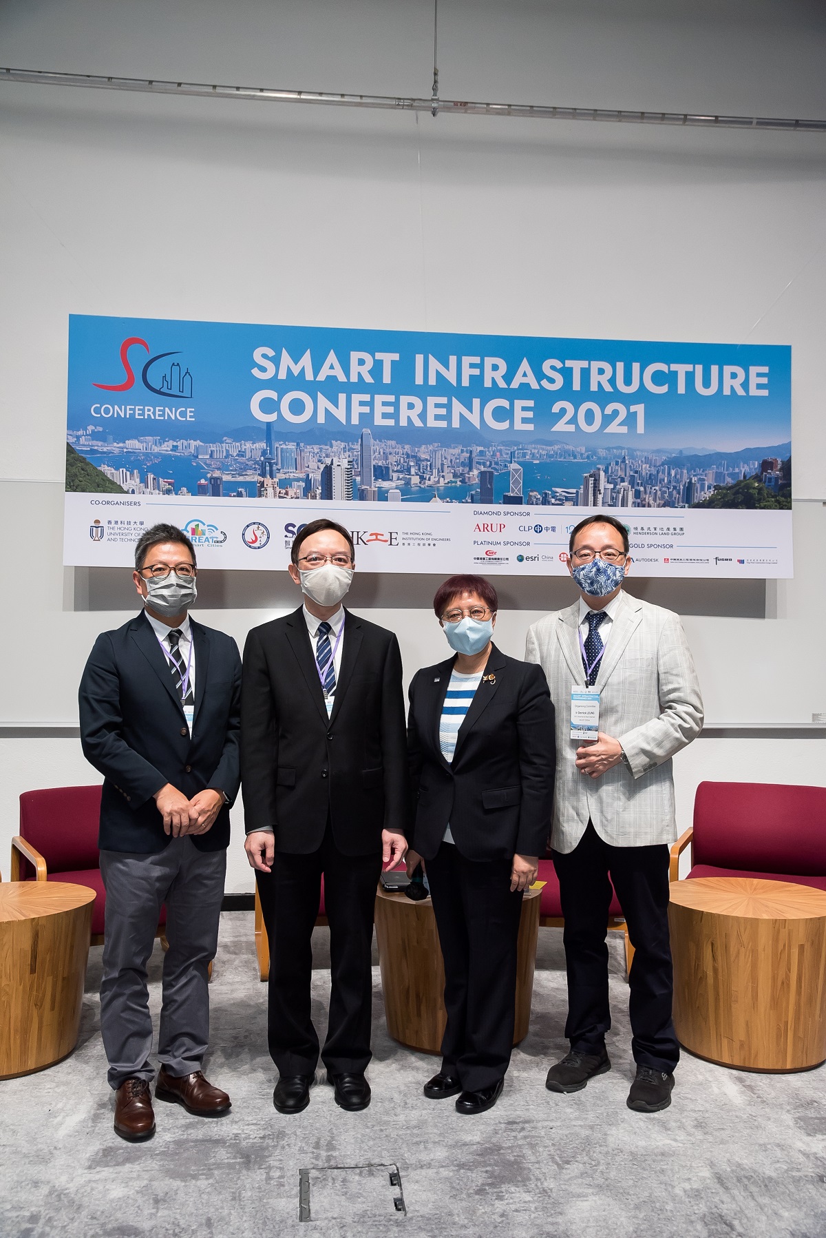 Mr. Victor Lam,  Government Chief Information Officer (second left), in group photo with Professor Hong Kam Lo, Department Head and Chair Professor of Civil and Environmental Engineering of the Hong Kong University of Science and Technology, & Director of GREAT Smart Cities Center (first left); Dr. Winnie Tang, Founder and Honorary President of Smart City Consortium (second right); and Ir. Derick Leung, Chairman of the Conference Organising Committee (first right), at the “Smart Infrastructure Conference 2021”.