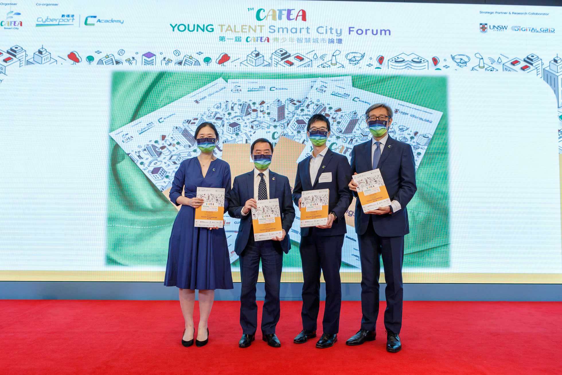 Mr. Tony Wong, Deputy Government Chief Information Officer (second left) in group photo with Ms. Christine Yip, Founder of CAFEA Smart City Limited (first left); Mr. Henry Lin, Chief Curriculum Development Officer (Technology Education) of the Curriculum Development Institute, Education Bureau (second right); and Mr. Peter Yan, Chief Executive Officer of Hong Kong Cyberport Management Company Limited (first right) at the 1st CAFEA Young Talent Smart City Forum.