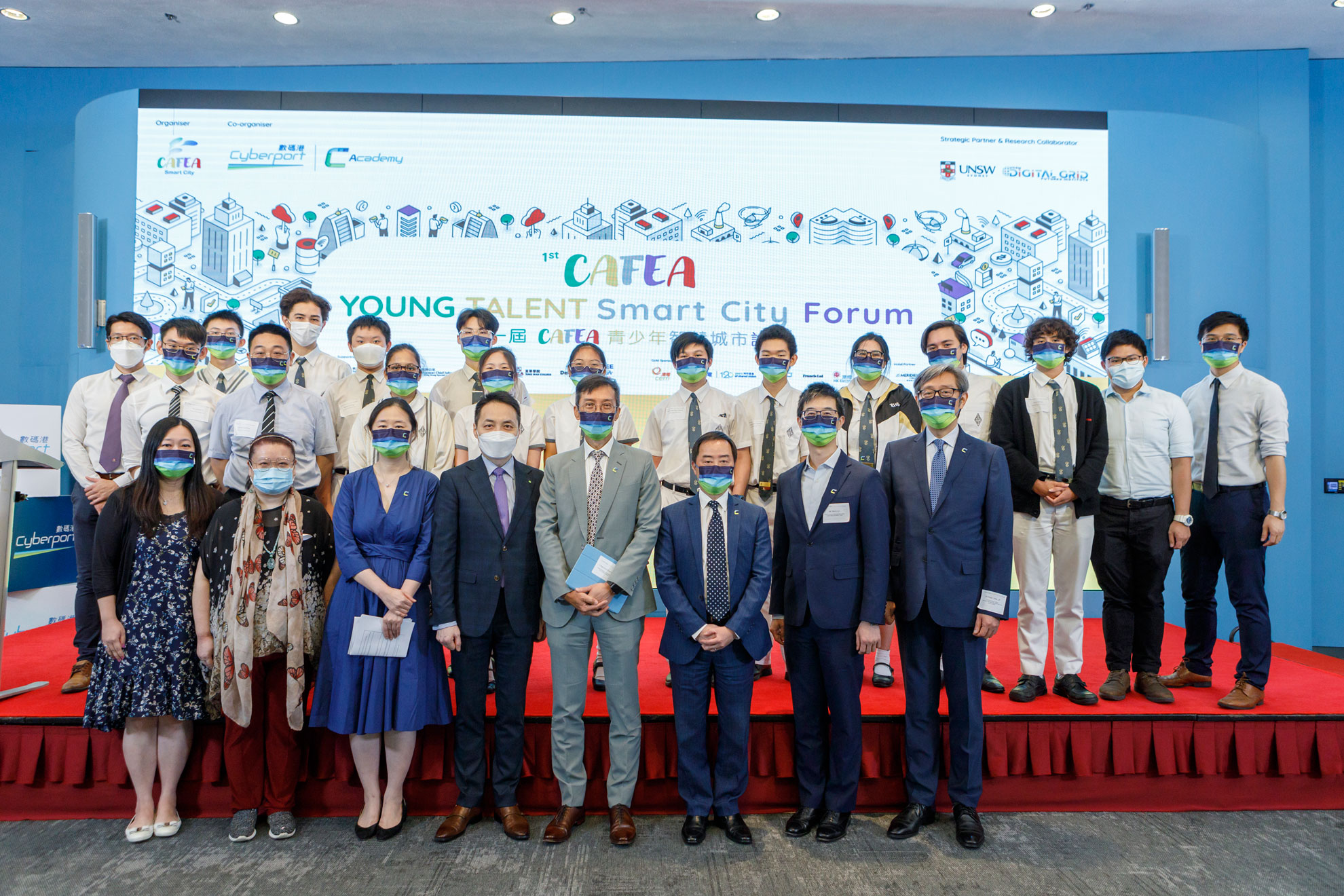 Mr. Tony Wong, Deputy Government Chief Information Officer (third right in first row) in group photo with other speakers and winning secondary school students.