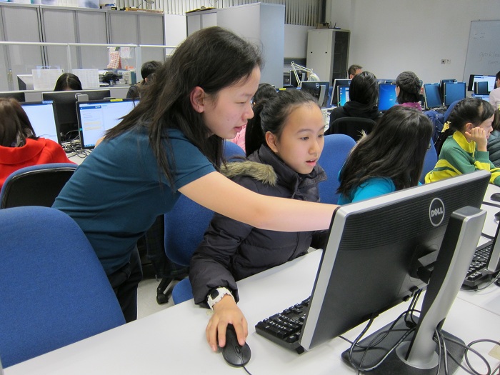 Student coding in Hour of Code workshop in December 2014
