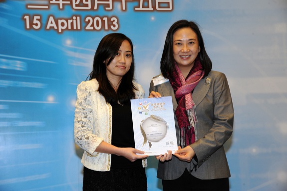 Legislative Council member, Dr Hon Elizabeth Quat, JP (right), presents a Silver Award certificate to the Senior Marketing Manager of Vocational Training Council (VTC), Ms Patricia Chan